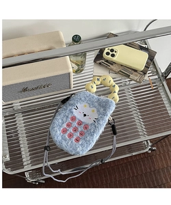Close-up of cute blue plush cat phone bag featuring soft faux fur and embroidery details