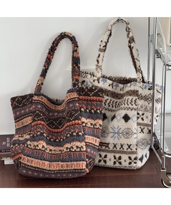 Detail view of plush jacquard tote bags in fleece fabric with vintage ethnic patterns
