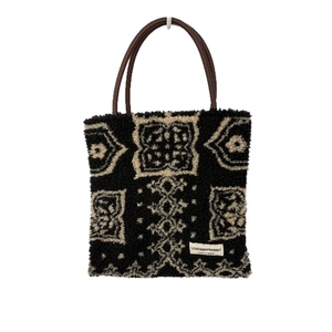 Fuzzy faux shearling tote bag with geometric pattern and brown faux leather handles