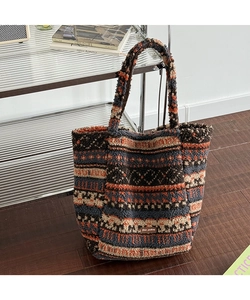 Detailed macro view of bohemian geometric pattern on fuzzy plush tote bag material