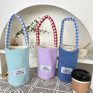 Plush insulated water bottle sleeves in blue and purple with checkered carry handles