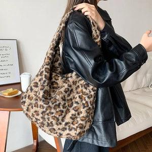 Close-up of leopard print faux fur tote bag with soft plush texture and large capacity