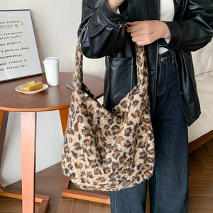 Detail of leopard print plush tote bag showing large capacity and soft texture
