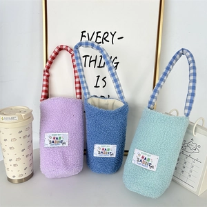 Plush lamb wool insulated water bottle sleeves in blue and purple with plaid handles