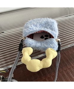Interior detail of light blue plush phone bag showing red checkered lining and capacity