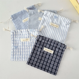 Blue striped and checkered fabric drawstring storage pouches with soft cotton ropes
