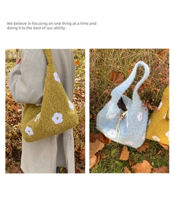 Detailed texture of plush knit tote bag with floral pattern and wooden button closure