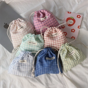 Set of colorful checkered drawstring storage bags for cosmetics and small items
