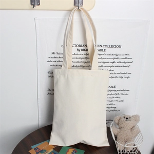 Detail showing the thick blank canvas tote bag in a minimalist indoor setting