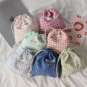 Close-up of colorful checkered drawstring bags made of soft linen for small items