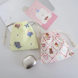 Detail of embossed bubble cotton drawstring storage bags with cute animal patterns