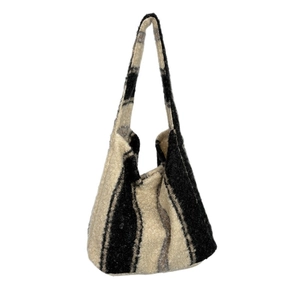 Minimalist black and white striped knit tote bag with thick woven texture for women