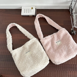 Chic plush tote bags in beige and pink with soft fuzzy texture for women
