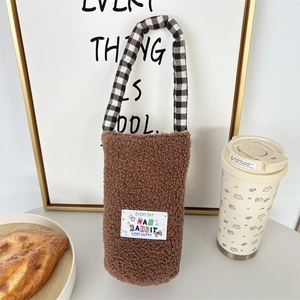 Brown fuzzy plush water bottle carrier bag with black and white checkered handles