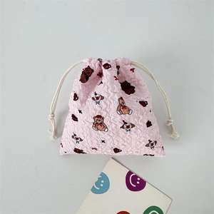 Detailed view of pink bubble texture fabric on a cute cartoon drawstring pouch