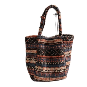 Bohemian style faux shearling tote bag with colorful geometric patterns and handles