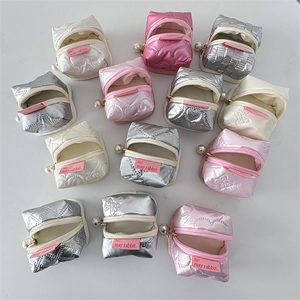 Mini PU leather pouches with heart quilting, pearl zippers and rabbit label detail