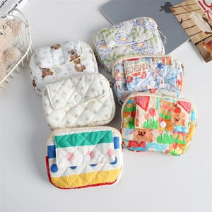 Flat lay of six cute floral and bear pattern quilted mini multi-purpose pouches
