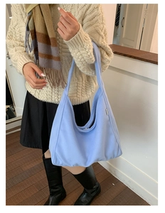 Detailed texture of light blue wool shoulder bag with large capacity for autumn and winter