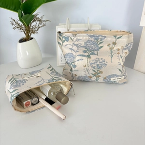Floral jacquard cosmetic bags with gold zippers and satin lining in two sizes