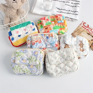Detailed view of assorted quilted cotton mini organizers with cute floral and bear patterns