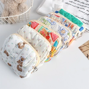 Quilted floral mini storage bags in various patterns for coins and accessories