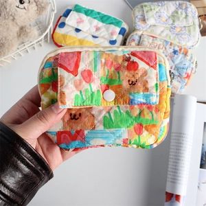 Quilted floral mini organizer with teddy bear print and snap button pocket closure