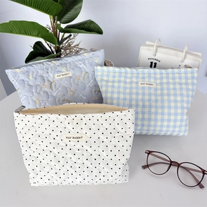Three-piece quilted makeup bag set with cartoon, plaid, and heart patterns by May Rabbit