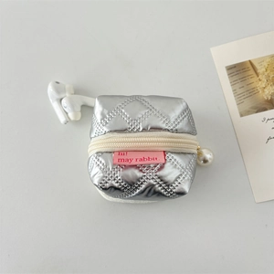 Detail of silver quilted PU earphone case with pearl pendant and pink hi! rabbit label