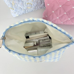 Minimalist quilted makeup bags in checkered, heart, and character prints with large capacity
