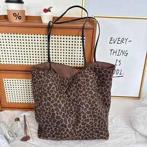 Faux suede leopard print tote bag with black leather straps for stylish daily commute