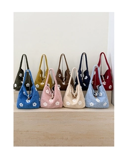 Multi-color collection of plush knit shoulder bags featuring white floral embroidery