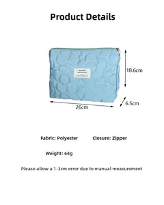 Detailed dimensions of light blue quilted floral polyester bag with zipper closure