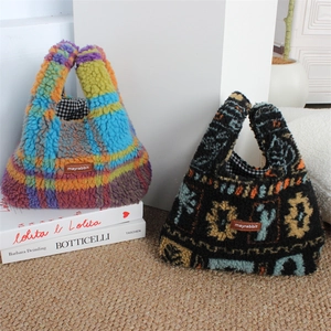 Detail of plush tote bags with colorful plaid and floral patterns with leather labels