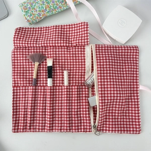 Floral makeup brush roll with slots and heart-pull zipper pouch for organization