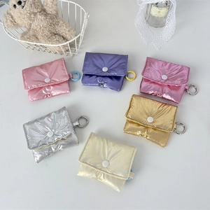 Detailed overhead view of puffy metallic earphone cases in six vibrant pastel colors