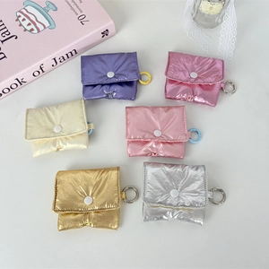 Group of six colorful quilted puffer cases for Airpods with metallic finish and metal hooks