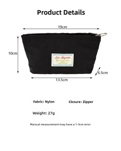 Detail view of a black nylon makeup pouch showing dimensions 19cm by 10cm and zipper closure