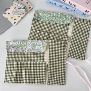 Floral makeup brush roll organizer with multiple slots and heart-shaped zipper pouch