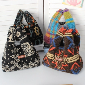 Detail view of plush lamb-like wrist bags with four distinct patterns and inner lining