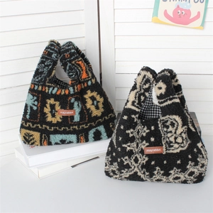 Close-up of plush tote bags with geometric patterns and soft lamb wool texture details
