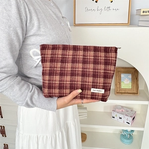 Close-up of premium checkered canvas bag with smooth zipper and MAY RABBIT brand label