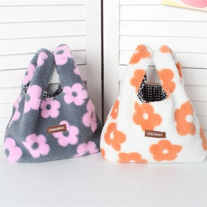 Detailed view of plush floral handbags featuring soft fleece fabric and checkered lining