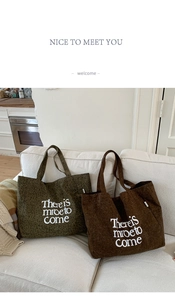 Detail showing leopard print and brown corduroy tote bags with white letter print