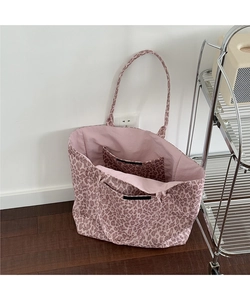 Detailed interior view of a pink leopard tote bag with a practical inner slip pocket