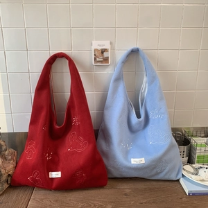 Fleece tote bag with bird embroidery in red and light blue colors for winter casual use