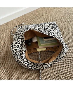 Spacious tote bag with black and white leopard print and brown faux suede lining detail