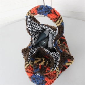 Detail view of colorful plush tote bag with checkered lining and interior capacity