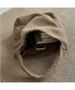 Top view of spacious brown fuzzy wool bucket bag showing interior lining and large capacity