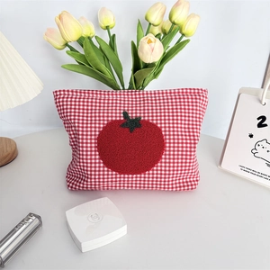 Detail of red checkered vanity bag with cute tomato towel embroidery and soft texture